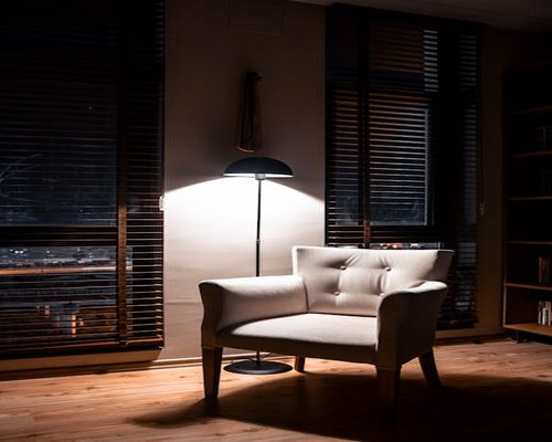 Cozy evening interior with a directional floor lamp focus for comfortable reading
